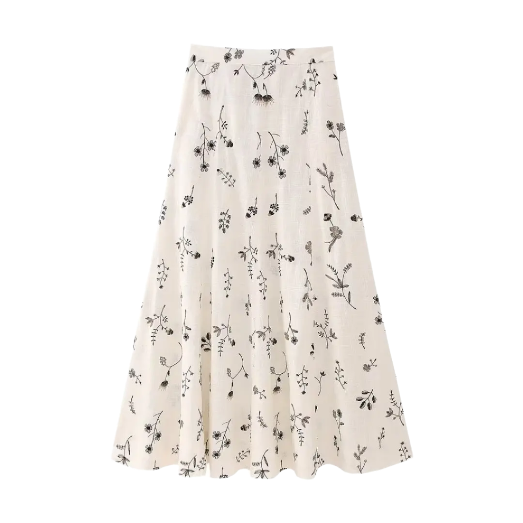 Outfit de verano con falda y top corto estampado sin mangas y falda línea A con cordón