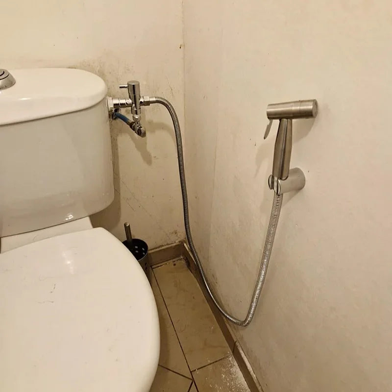 Handheld bidet sprayer made of stainless steel with a 3-way valve (G1/2" – 3/8") for toilet cleaning and personal hygiene.