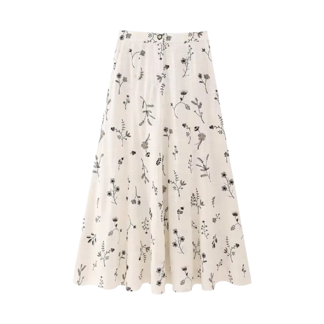 Outfit de verano con falda y top corto estampado sin mangas y falda línea A con cordón